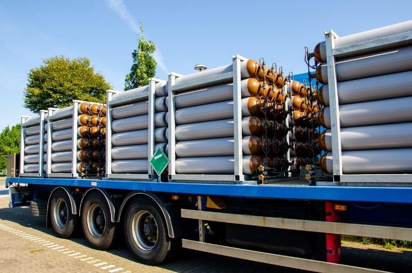 Gas cylinder trailer parked at a depot